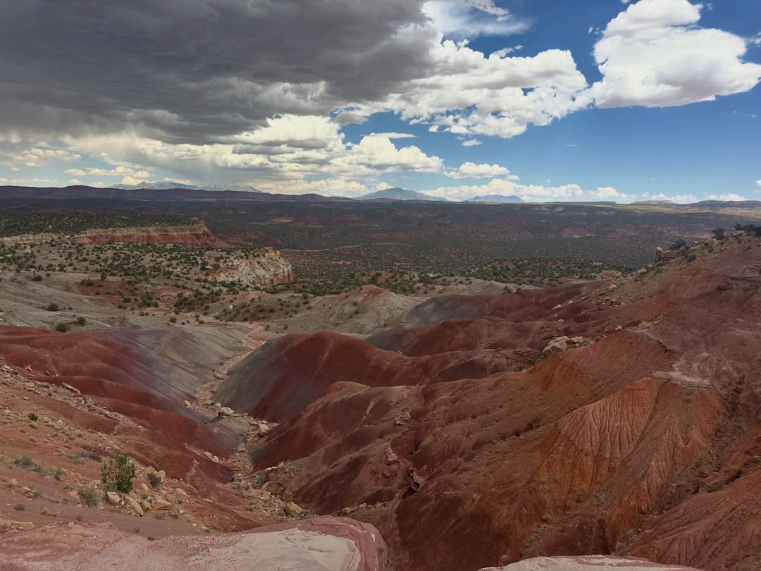 Rock formations in Grand Staircase–Escalante beneath a dramatic sky, photographed by UTAZNM